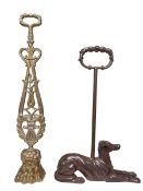 Ornate whippet and brass paw doorstops.