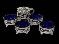 Art Nouveau silver five piece cruet set with blue glass liners, Birmingham 1904.