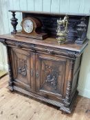 Continental carved oak cabinet with raised back, 137cm by 122cm by 57cm.