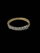 Diamond seven stone band 18 carat gold ring, size J/K.