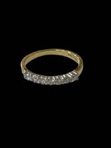 Diamond seven stone band 18 carat gold ring, size J/K.