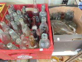 Collection of vintage glass bottles including J.