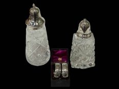 Pair of Victorian silver napkin rings, Birmingham 1890, and two silver topped crystal casters (3).