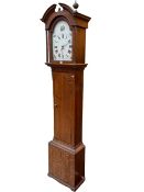 Antique oak cased 30 hour longcase clock having painted arched dial, 220cm.