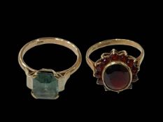 Two 9 carat gold rings, garnet and green spinel.