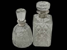 Two silver collared crystal decanters.