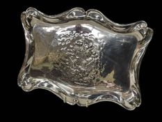 Chester hallmarked silver serpentine sided dressing table tray with winged cherubs, 1905,