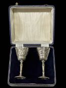 Mappin & Webb pair of silver goblets with foliate chased bowls, Sheffield 1977, 11.5cm, cased.