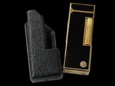 Dunhill gilt and black enamel gas cigarette lighter with Dunhill leather holder.