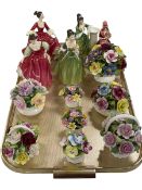 Four Royal Doulton figurines, bone china figure and eight china posies.