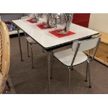 Tavo, Belgium, Mid Century rectangular Formica topped kitchen table and two chairs.