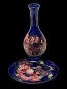 Large Moorcroft vase and dish each decorated with anemone on blue ground.