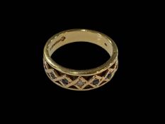 Sapphire and diamond set 18 carat gold band ring, size O.