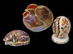 Two Royal Crown Derby paperweights and Royal Crown Derby egg on stand (3).