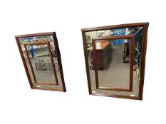 Pair polished mahogany framed bevelled and floral decorated wall mirrors, 117cm by 86cm.