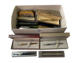 Box of various pens.