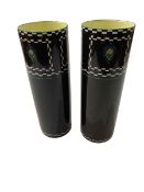 Pair Royal Doulton cylindrical vases with stylised decoration on black ground, 25cm.