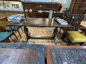 Oak refectory table raised on carved bulbous pillars, 75cm by 75cm by 165cm.