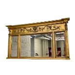 Regency style gilt framed triple bevelled panel overmantel mirror, 75cm by 139cm.