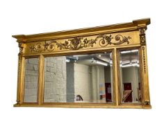 Regency style gilt framed triple bevelled panel overmantel mirror, 75cm by 139cm.