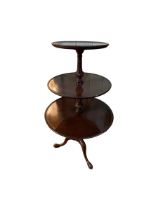 Mahogany three tier graduated circular dumb waiter on tripod base, 111cm.