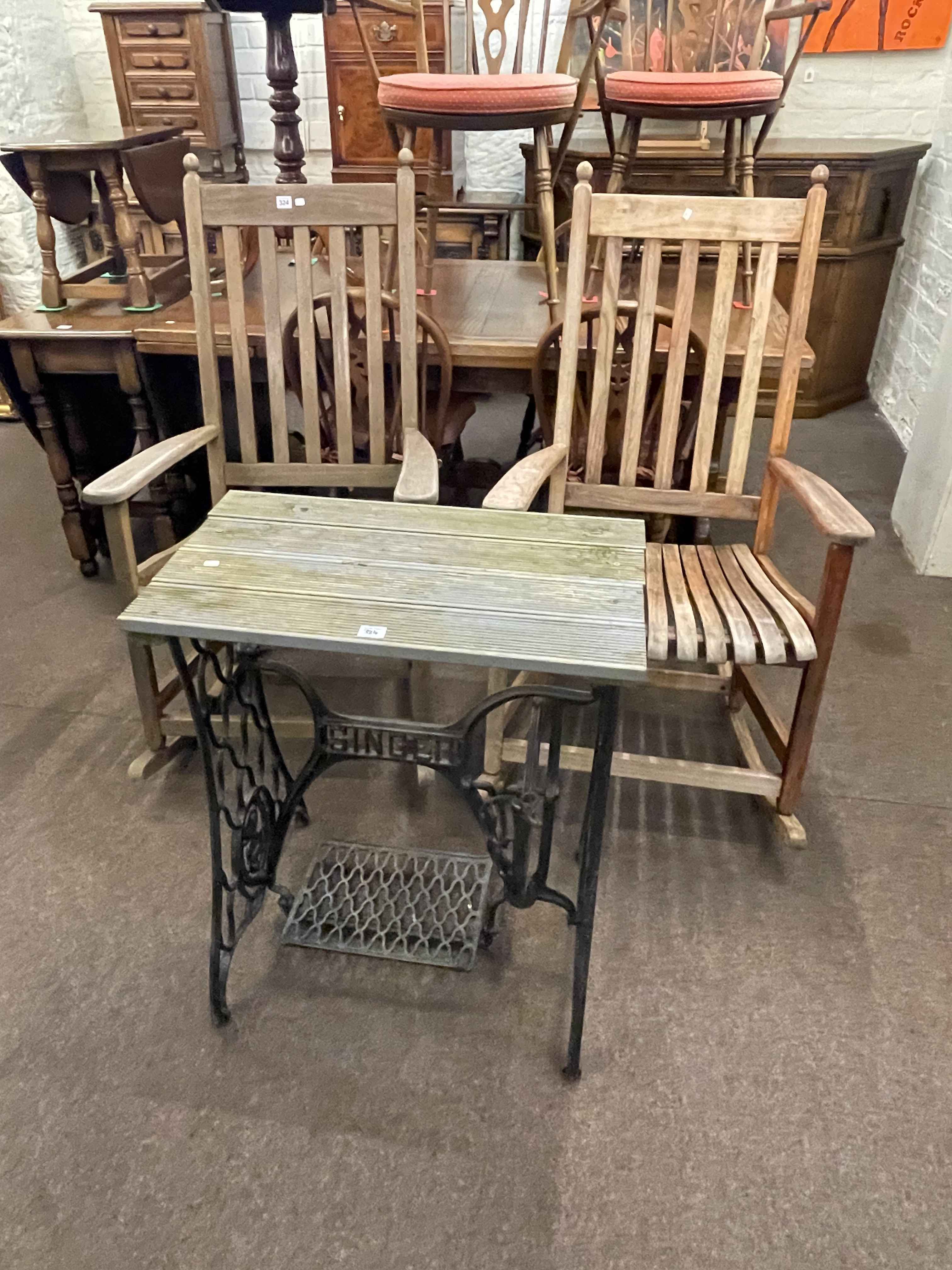 Pair teak exterior rocking chairs and Singer cast base garden table (3).