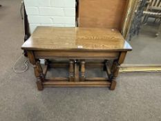 Rectangular oak nest of three turned leg tables.