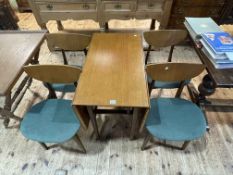 Mid Century teak drop leaf dining table and set of four dining chairs.
