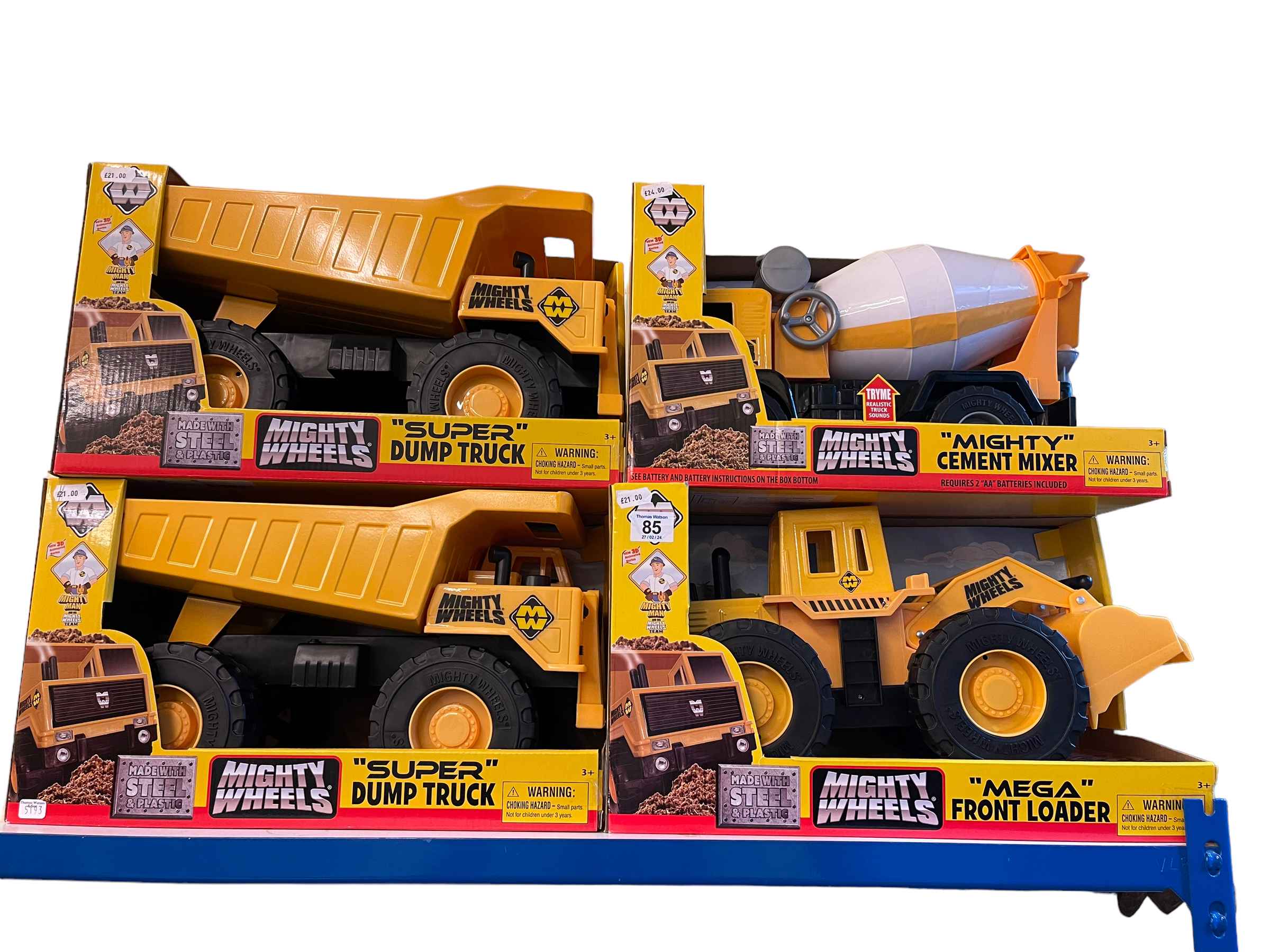 Four mighty wheels dump truck, cement mixer and front loader.