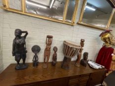 Collection of carved African sculptures, bust and a drum.