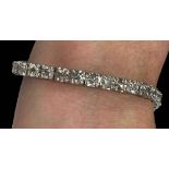 Diamond 18 carat white gold tennis bracelet with 34 diamonds totalling over 11 carats, 17.