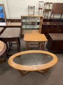 Turnidge of London teak sliding glazed door cabinet, nest of three tables and oval coffee table (3).