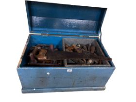 Tool chest containing collection of woodworking tools, saws, planes, etc.