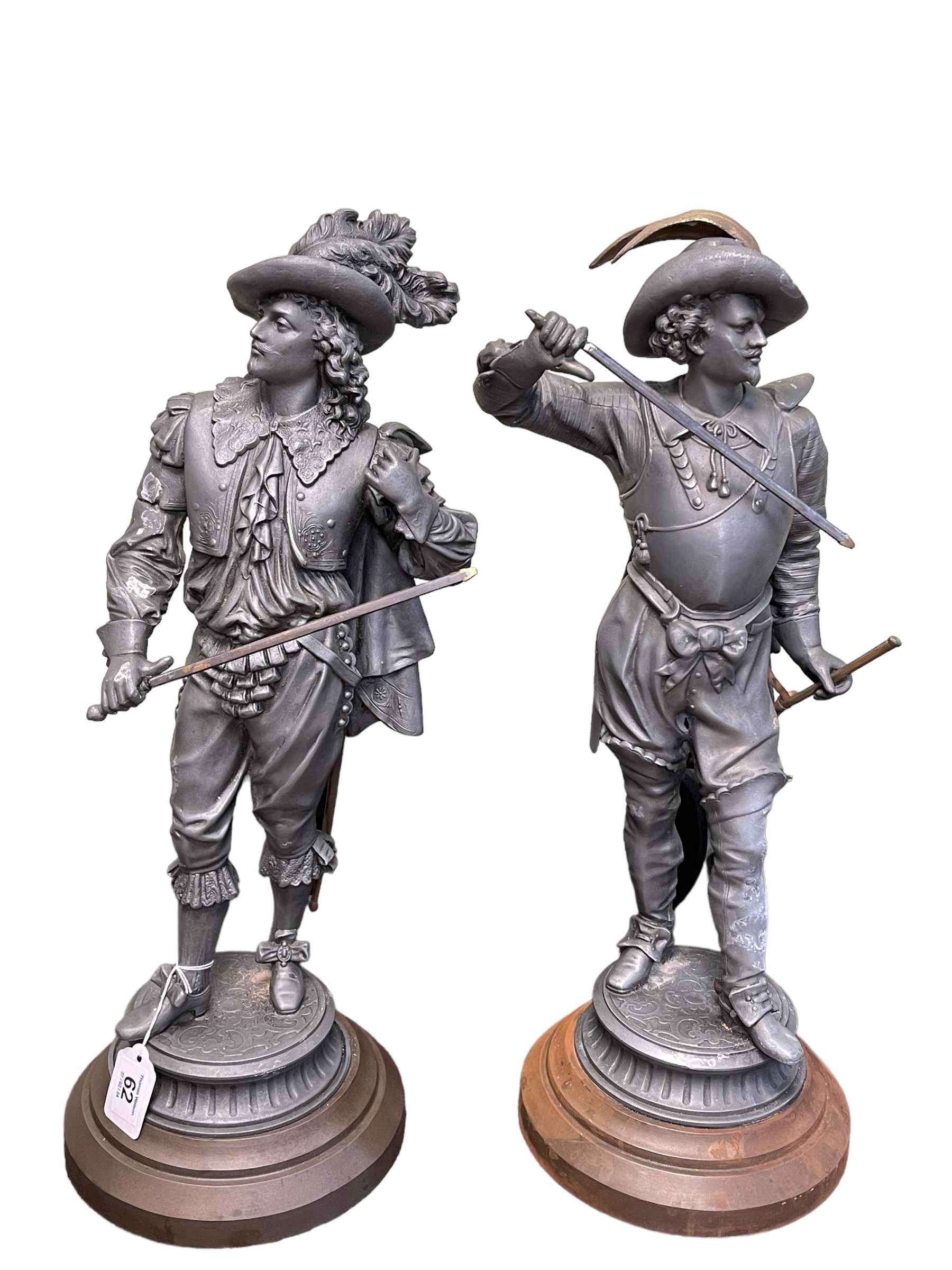 Two cast metal Cavalier sculptures, 51cm highest.