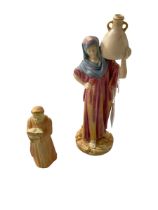 Royal Worcester water carrier, 24.5cm and Royal Worcester Monk candle snuffer (2).