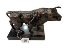 Bronzed finish metal bull on plinth, 28cm across.