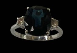 Sapphire and diamond three stone 18 carat gold ring, with large cushion sapphire over 4.