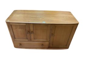 Ercol Windsor sideboard having three doors and a base drawer,