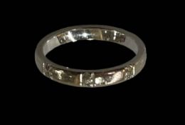 18 carat white gold diamond set wedding band ring, size M.