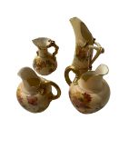 Four Royal Worcester blush ware jugs.