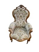 Victorian mahogany framed armchair in sage green and floral decorated buttoned draylon.