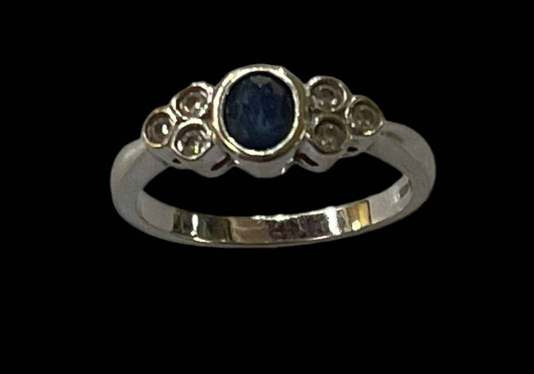 Sapphire and diamond 9 carat white gold ring, size L.