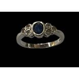 Sapphire and diamond 9 carat white gold ring, size L.