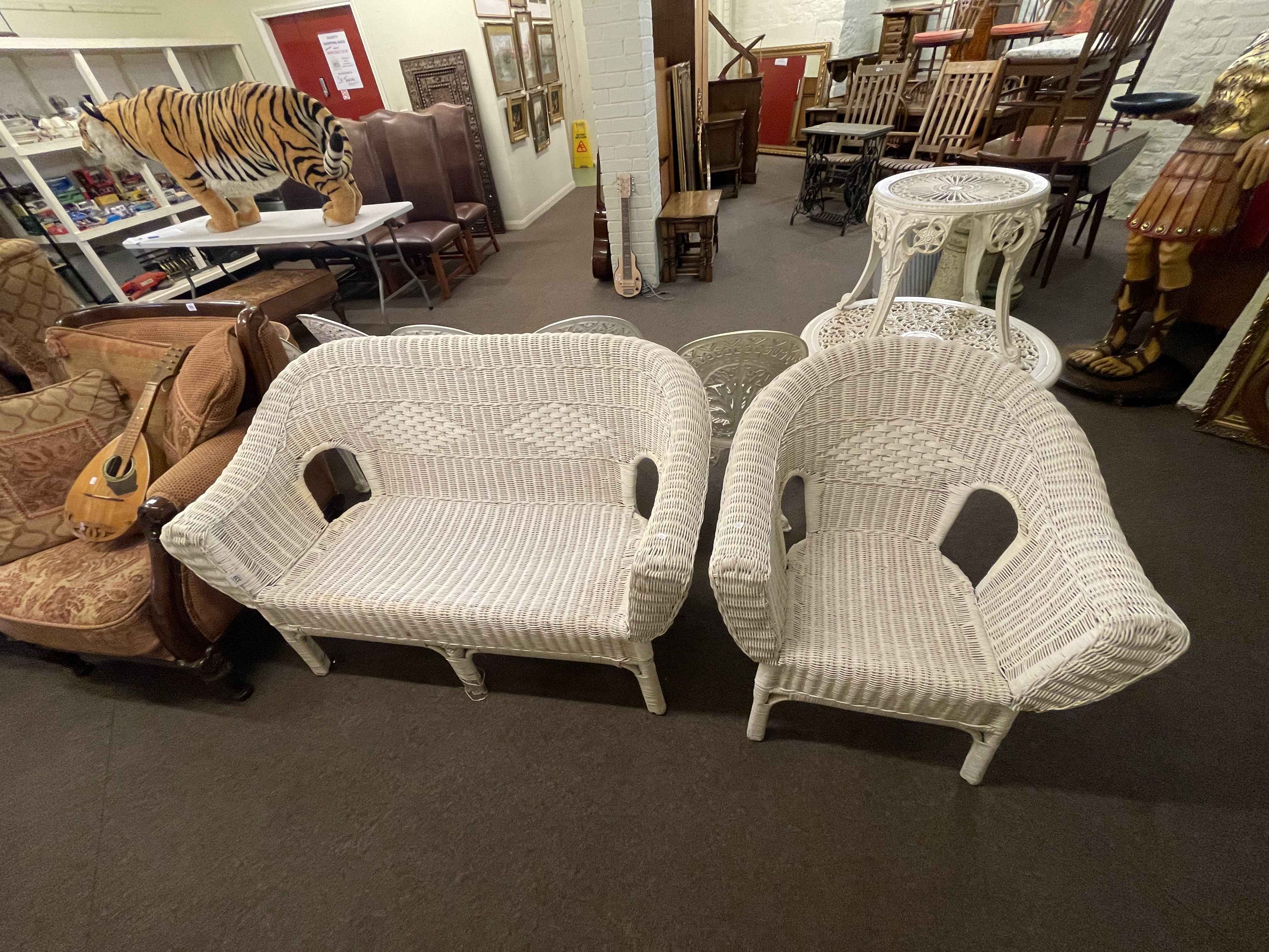 Basket weave conservatory settee and chair.