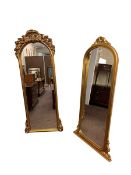 Two rectangular gilt framed arched top wall mirrors (largest 178.5cm by 72cm).