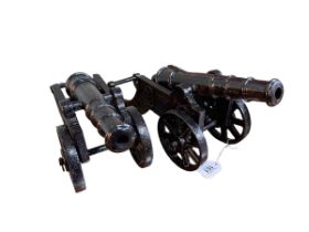 Pair of cast metal cannons, 19cm high.