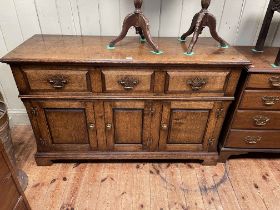 Period style oak dresser having three drawers above three fielded panel doors,