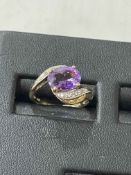 Amethyst and diamond 9 carat gold ring, size L.