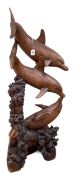 Carved wooden sculpture of three bottle nose dolphins, 149cm in height.