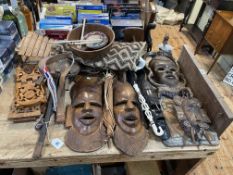 Collection of African carved masks, panel, musical instruments, etc.